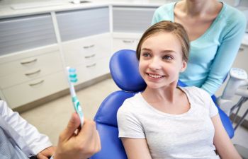 girl during the dentist checkup